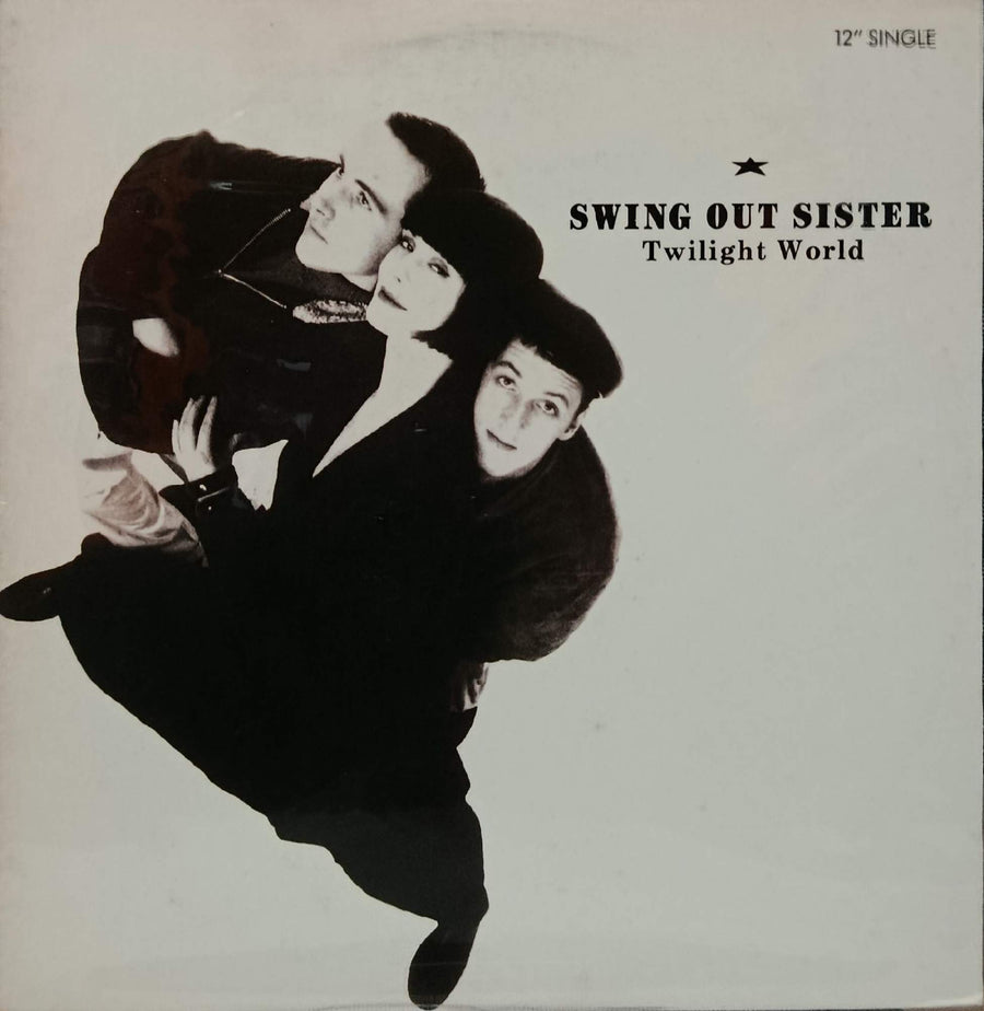 Single cover for Swing Out Sister's 'Twilight World' 12" single, featuring a black-and-white artistic photo of two women in dark clothing against a light off-white background with black text.